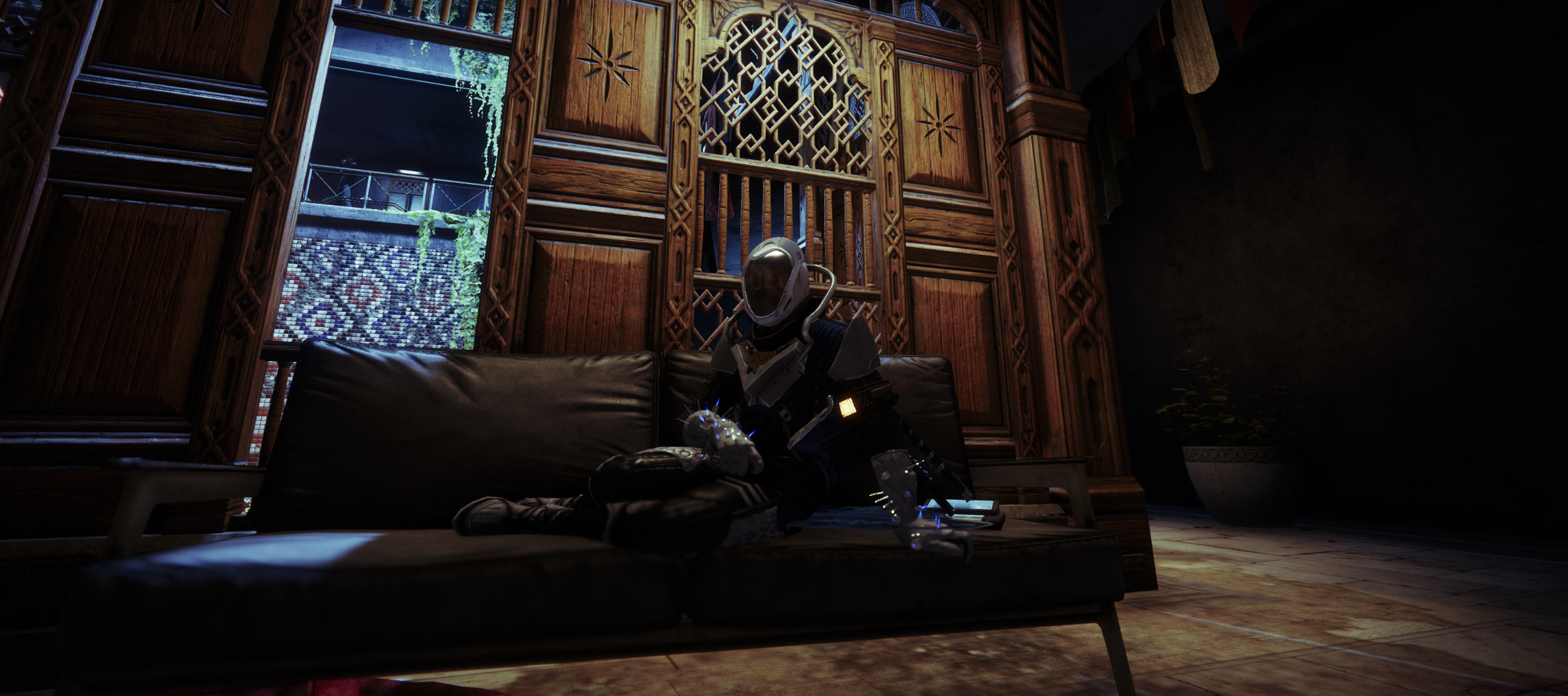 Destiny 2 Guardian relaxing on a couch in an ornate lounge